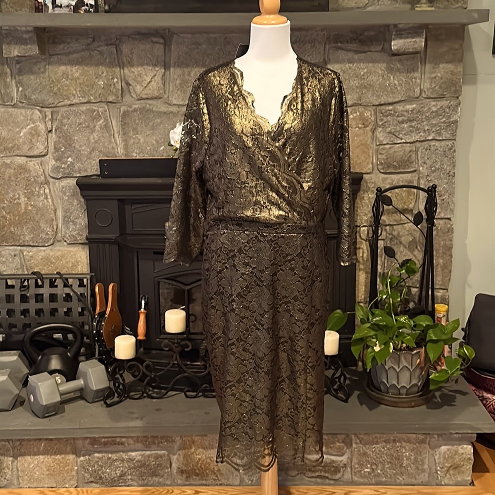 Lace gold overlace over black dress.